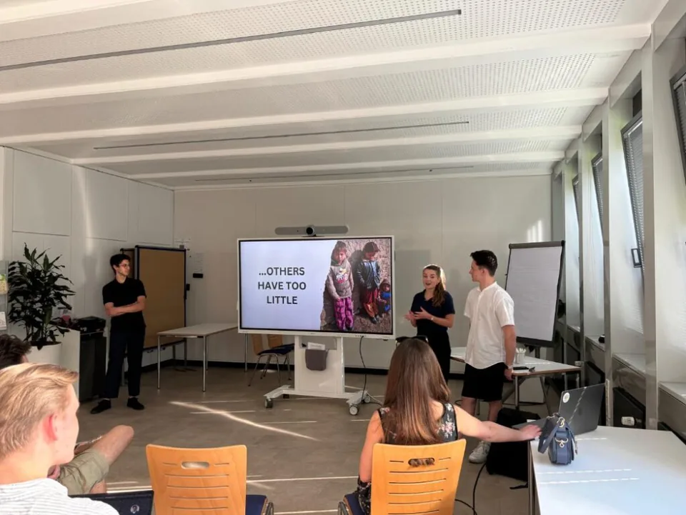 Enactus Munich members presenting a social entrepreneurship idea during a workshop