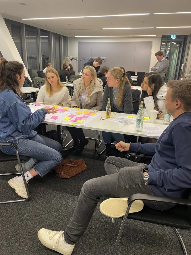 Members developing ideas together with sticky notes at a Basic Curriculum workshop
