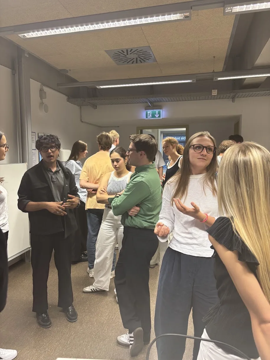 Participants exchanging ideas in small groups during the VC Workshop