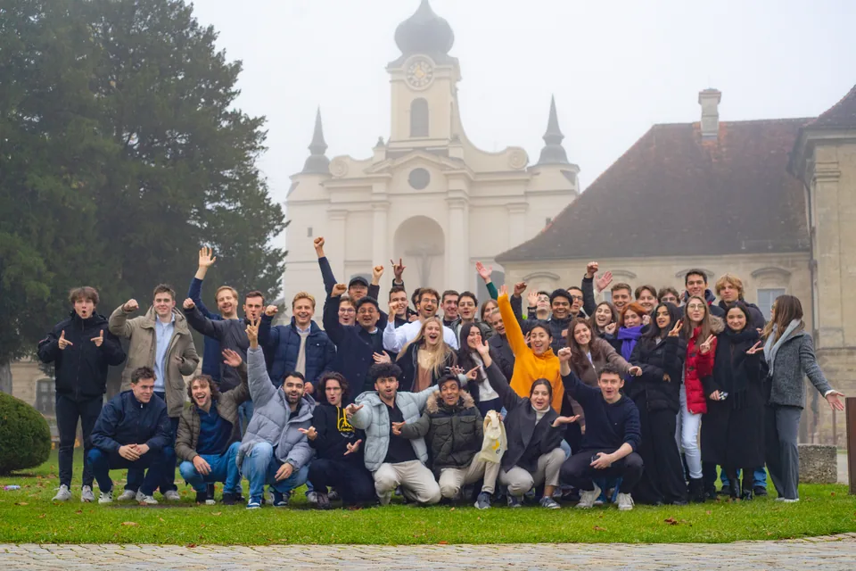 Enactus Munich team together in front of a church at OEW