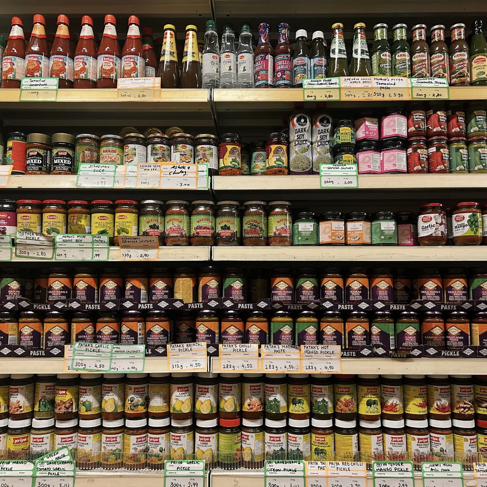 A local grocery store's shelves stocked with sauces, chutneys and pickles